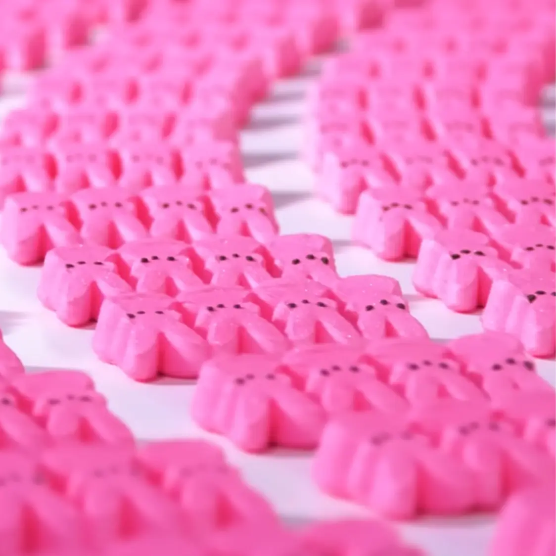 Rows of pink marshmallow bunnies.