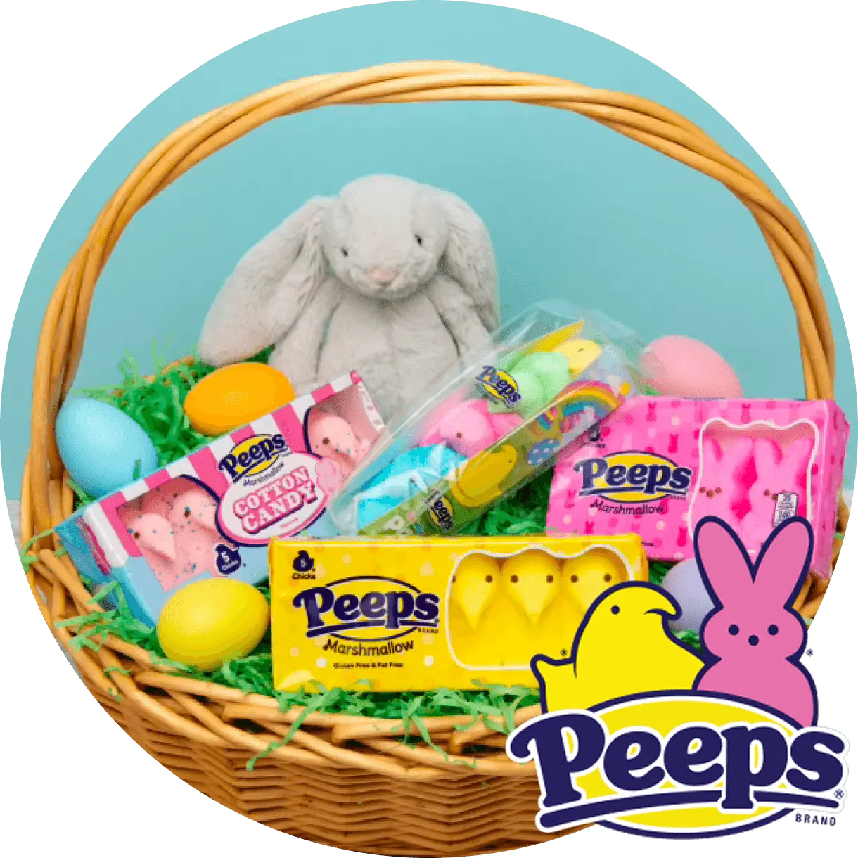 Wicker Easter basket with a gray plush bunny, Peeps marshmallow candies, and colorful eggs on green grass against a blue background.